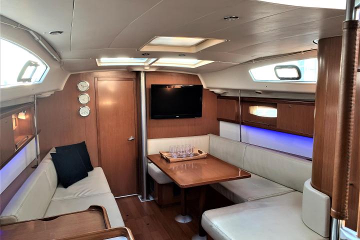 a bedroom with a bed and desk in a room