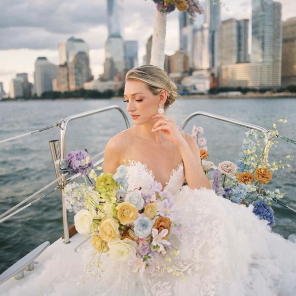 woman posing with flowers after a boat marriage proposal in New York City