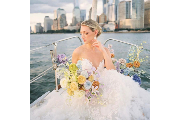 woman in a wedding dress on a romantic boat ride in NYC