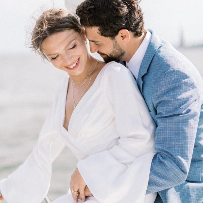 a man and a woman embracing during a romantic cruise in NYC