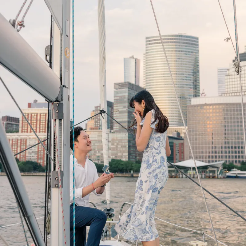 man kneeling and proposing during a private boat ride in NYC for 2