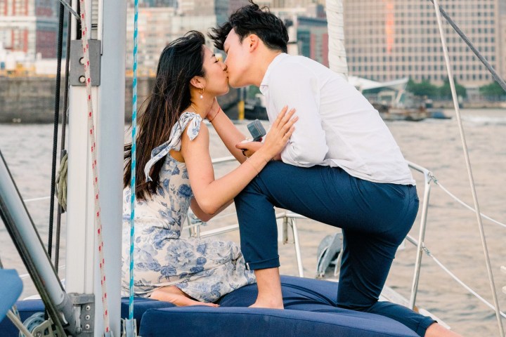 couple kissing during a boat proposal NYC