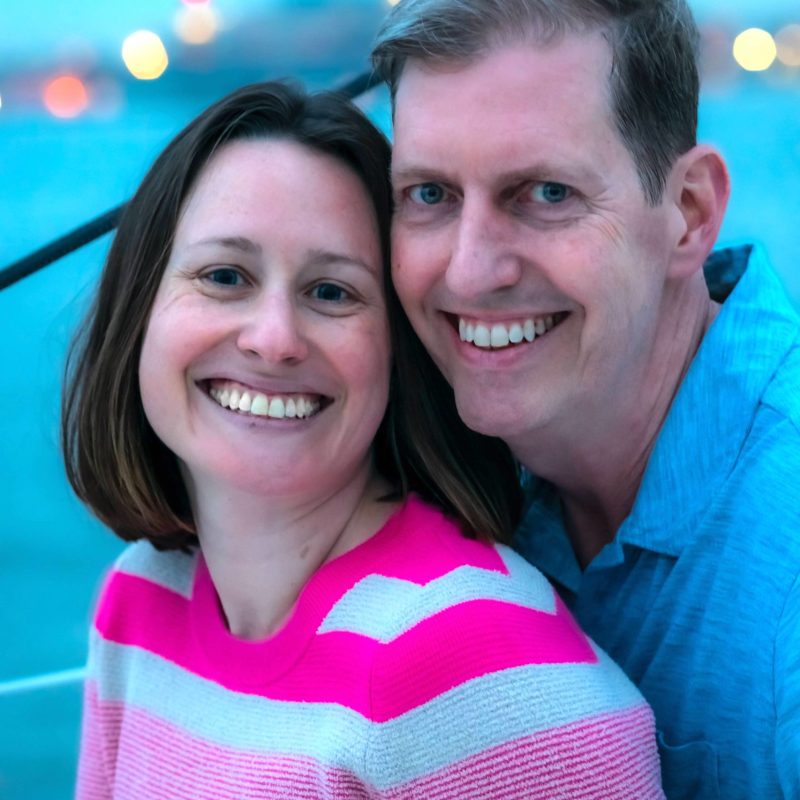 engagement photoshoot of smiling man and woman on a romantic boat in NYC