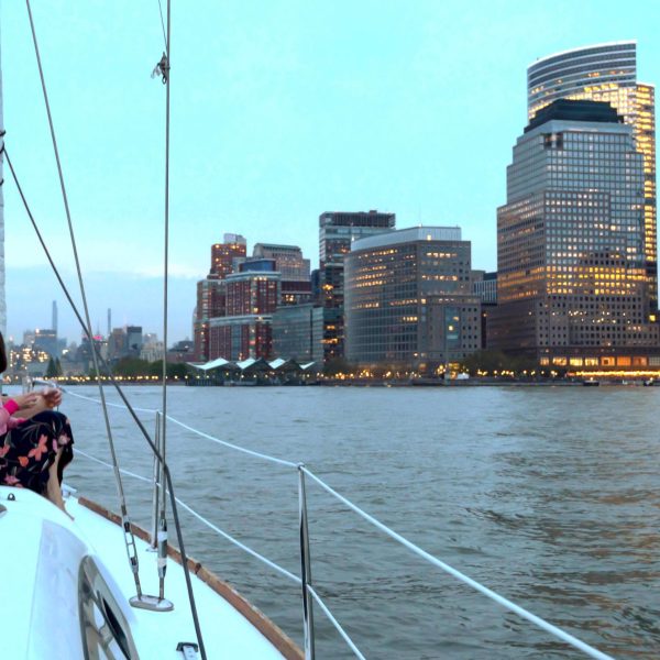 couple sitting at the bow of the boat during a romantic boat ride of NYC