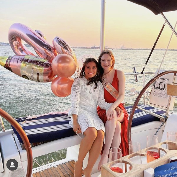 two women with balloons on birthday yacht rental