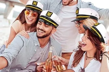 a group of friends wearing captain hats on a yacht birthday party NYC