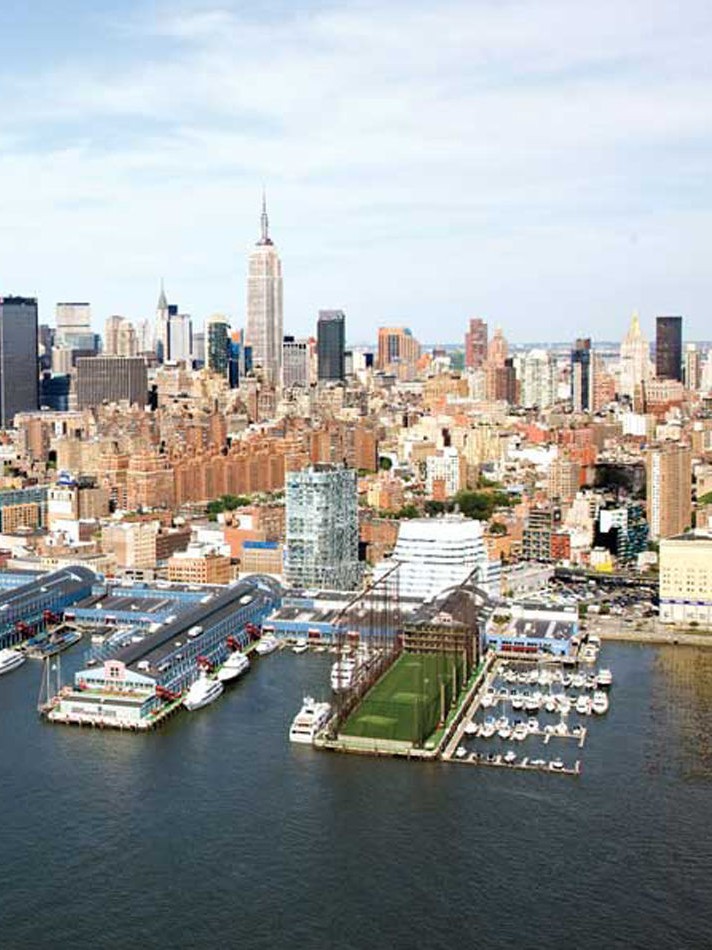 chelsea piers marina with boat charters and golf club and the NYC skyline in the background