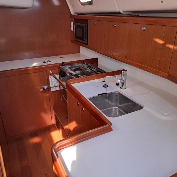 a kitchen with a sink and a microwave