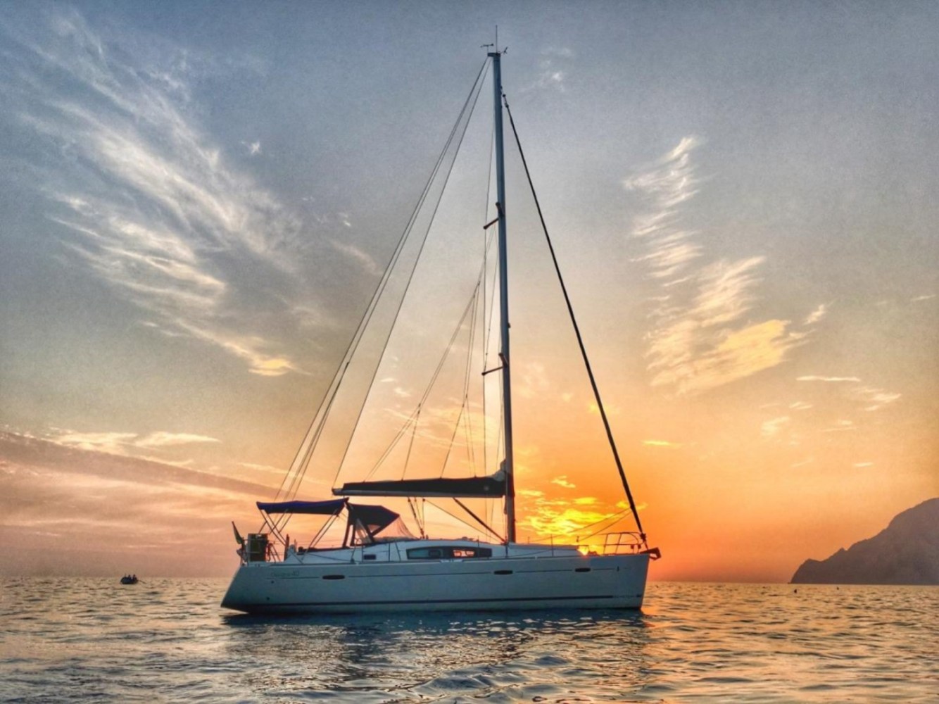 side view of a small boat rental in NYC during sunset