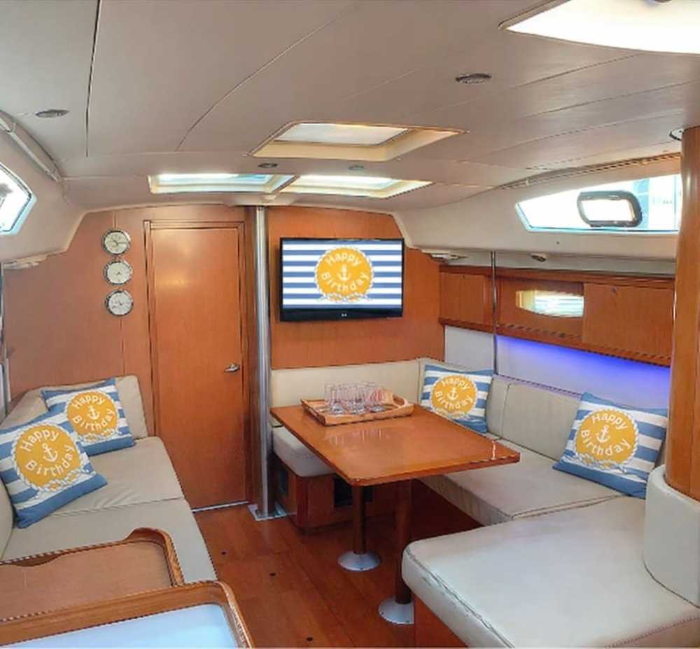Interior of a yacht with nautical decor and 'Happy Birthday' pillows for a private party in NYC.