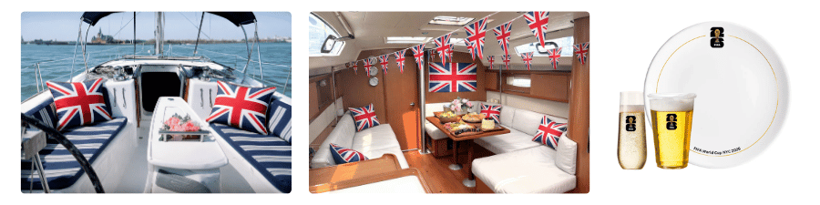 Sailboat interior and exterior with Union Jack decor, and beer on a white plate.